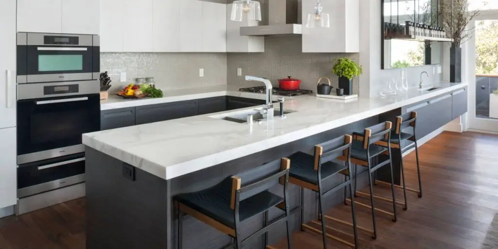 an undermount sink u-shaped dark wood floor kitchen