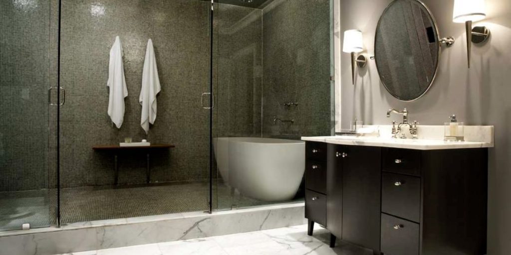 tiny-oval-shaped-bathtub-in-a-dark-coloured-bathroom