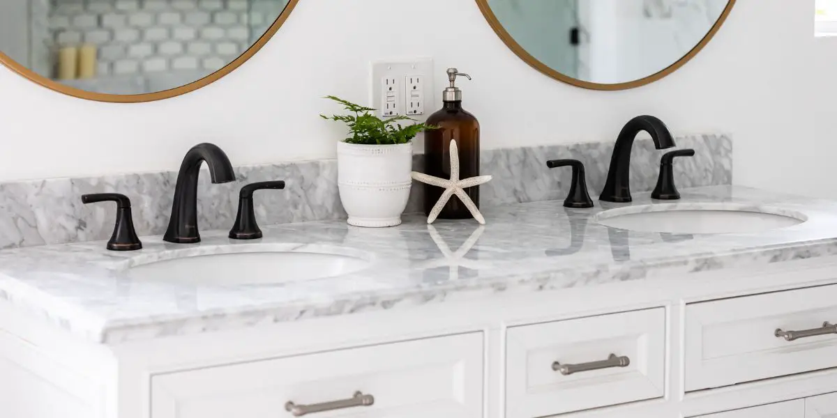 white marble bathroom vanity under mount sink