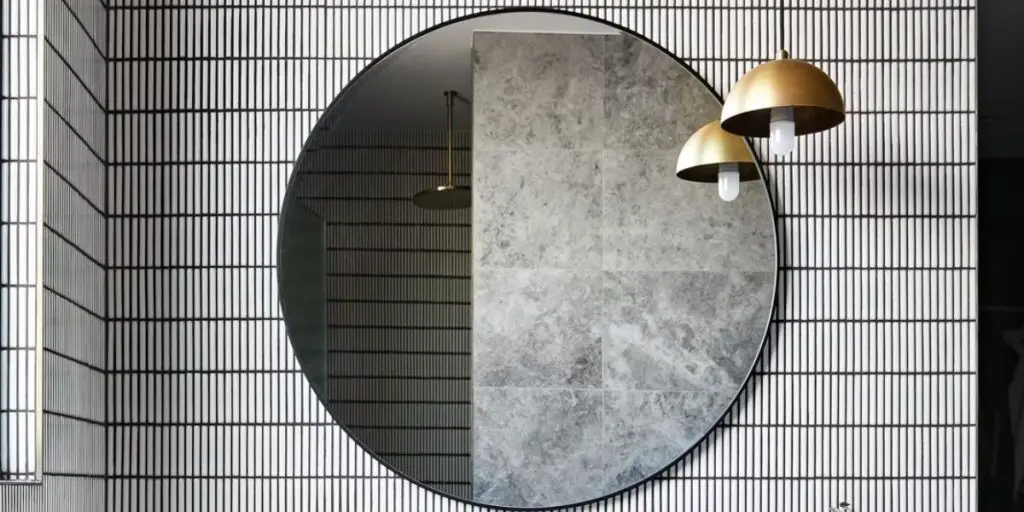 Stunning round bathroom mirror with a black frame