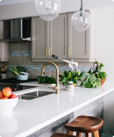 Picture of a kitchen: A shiny kitchen with faucet, sink, stool, cabinet and more